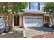 Charming townhome featuring a two-car garage and a well-manicured lawn at 5492 Glenridge Dr # 536, Atlanta, GA 30342
