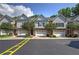 Exterior front view of townhomes showcasing brick and siding facades, driveways and two car garages at 5492 Glenridge Dr # 536, Atlanta, GA 30342