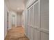 Bright hallway featuring hardwood floors and spacious closet with bi-fold doors at 5492 Glenridge Dr # 536, Atlanta, GA 30342