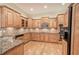 Gourmet kitchen featuring granite countertops, custom wood cabinets, and stainless steel appliances at 5492 Glenridge Dr # 536, Atlanta, GA 30342