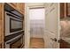 Gourmet kitchen featuring a double oven, a walk-in pantry and granite countertops at 5492 Glenridge Dr # 536, Atlanta, GA 30342