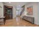 Spacious room featuring a staircase, bookshelf, and hardwood floors at 5492 Glenridge Dr # 536, Atlanta, GA 30342