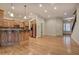 Open-concept living area adjoining kitchen, showcases hardwood floors and seamless transition to other living spaces at 5492 Glenridge Dr # 536, Atlanta, GA 30342