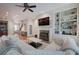 Bright living room with built-in shelving, fireplace, and comfortable seating at 5492 Glenridge Dr # 536, Atlanta, GA 30342