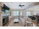 Well-lit living room with fireplace, built-in shelves, hardwood floors, and an open layout at 5492 Glenridge Dr # 536, Atlanta, GA 30342