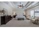Charming main bedroom features a tray ceiling, fireplace, and sitting area at 5492 Glenridge Dr # 536, Atlanta, GA 30342