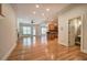 Open floor plan with hardwood floors connecting the living area and kitchen at 5492 Glenridge Dr # 536, Atlanta, GA 30342