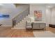 Staircase with wood trim and decorative iron railing leads to the upper level at 5492 Glenridge Dr # 536, Atlanta, GA 30342