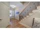 Elegant staircase with hardwood steps and wrought iron railing at 5492 Glenridge Dr # 536, Atlanta, GA 30342