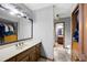 Traditional bathroom featuring a wood vanity with sink, large mirror, and a separate water closet at 2041 Millspring Nw Way, Kennesaw, GA 30152