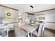 Dining room with modern farmhouse decor and seating for six at 2041 Millspring Nw Way, Kennesaw, GA 30152