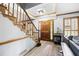 Welcoming entryway featuring hardwood floors, staircase, natural light and wood trim at 2041 Millspring Nw Way, Kennesaw, GA 30152