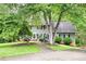 Charming two-story home with traditional architecture and a well-manicured front yard at 2041 Millspring Nw Way, Kennesaw, GA 30152