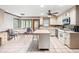 Bright kitchen with a center island, tile floors, white cabinets, and a breakfast nook area at 2041 Millspring Nw Way, Kennesaw, GA 30152