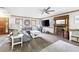 Inviting living room featuring hardwood floors, fireplace, and lots of natural light at 2041 Millspring Nw Way, Kennesaw, GA 30152