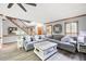 Inviting living room with comfortable seating, staircase, and lots of natural light at 2041 Millspring Nw Way, Kennesaw, GA 30152