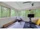 Sunroom with lots of natural light, a chair, and an exercise bike at 2041 Millspring Nw Way, Kennesaw, GA 30152