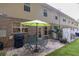 Paver patio with a table, chairs, and grill, perfect for outdoor entertaining at 3982 Brockenhurst Dr, Buford, GA 30519
