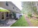 Backyard with a brick patio, outdoor seating, and manicured landscaping at 3982 Brockenhurst Dr, Buford, GA 30519