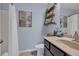 Bathroom featuring a shower, vanity, toilet, and shelving unit at 3982 Brockenhurst Dr, Buford, GA 30519