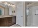 Bathroom featuring double vanity, shower, and neutral colors at 3982 Brockenhurst Dr, Buford, GA 30519