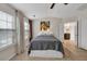 Bright bedroom with large windows, neutral decor, and an ensuite bathroom at 3982 Brockenhurst Dr, Buford, GA 30519