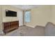 Bedroom featuring a futon, vintage radio cabinet, and natural light at 3982 Brockenhurst Dr, Buford, GA 30519