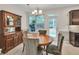 Cozy dining area with natural light, stylish furnishings, and a view of the outdoors at 3982 Brockenhurst Dr, Buford, GA 30519