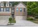 Charming brick home featuring a two-car garage and well-maintained landscaping at 3982 Brockenhurst Dr, Buford, GA 30519