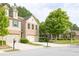 View of the home's exterior showcasing its well-manicured lawn and tree lined street at 3982 Brockenhurst Dr, Buford, GA 30519