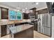Kitchen featuring an island, stainless appliances, granite countertop, and a window with view at 3982 Brockenhurst Dr, Buford, GA 30519