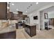 Bright kitchen featuring an island, stainless appliances, and a view into another room at 3982 Brockenhurst Dr, Buford, GA 30519