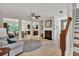 Open-concept living room featuring a fireplace, hardwood floors, and a neutral color scheme at 3982 Brockenhurst Dr, Buford, GA 30519