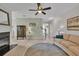 Spacious living room with a fireplace, modern furnishings, and an inviting atmosphere at 3982 Brockenhurst Dr, Buford, GA 30519