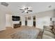 Spacious upstairs living room with TV, neutral decor, and wood-look flooring at 3982 Brockenhurst Dr, Buford, GA 30519