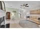 Well-lit living room with a fireplace, contemporary decor, and a comfortable seating area at 3982 Brockenhurst Dr, Buford, GA 30519