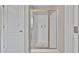 Bathroom featuring a modern shower with glass doors and brushed metal fixtures at 3982 Brockenhurst Dr, Buford, GA 30519