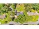 Aerial view of property surrounded by a large, grassy yard and mature trees at 6863 Recreation Ln, Acworth, GA 30102