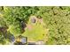 Aerial view of the property showcasing a large backyard, shed, and mature trees at 6863 Recreation Ln, Acworth, GA 30102