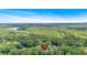 Overhead view of property and nearby lake surrounded by forest trees at 6863 Recreation Ln, Acworth, GA 30102