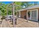 Exterior view of the back deck featuring a pergola and seating area at 6863 Recreation Ln, Acworth, GA 30102