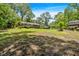 Spacious backyard featuring lush greenery, a shed, and a small wooden deck at 6863 Recreation Ln, Acworth, GA 30102