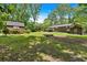 Beautiful backyard with shed, additional storage and a back deck on the house at 6863 Recreation Ln, Acworth, GA 30102