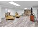 Finished basement featuring updated floors, a stone fireplace and cozy seating at 6863 Recreation Ln, Acworth, GA 30102