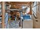 Unfinished basement area, including washer, dryer and storage shelving at 6863 Recreation Ln, Acworth, GA 30102