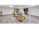 Basement featuring a stone fireplace, updated floors and lots of open space at 6863 Recreation Ln, Acworth, GA 30102