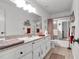 Spacious bathroom with granite vanity, framed mirror, tiled floors and shower, and plenty of cabinet space at 6863 Recreation Ln, Acworth, GA 30102