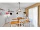 Bright dining area with decorative chandelier and a rustic table at 6863 Recreation Ln, Acworth, GA 30102