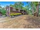 Well-kept two-story home with a charming exterior, landscaped yard, and convenient driveway access at 6863 Recreation Ln, Acworth, GA 30102