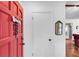 Bright entry featuring a vibrant red door, creating a welcoming atmosphere in the home at 6863 Recreation Ln, Acworth, GA 30102
